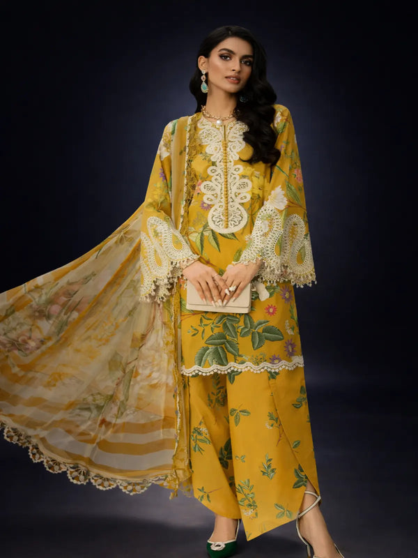 Woman wearing yellow unstitched printed suit with floral design and lace details