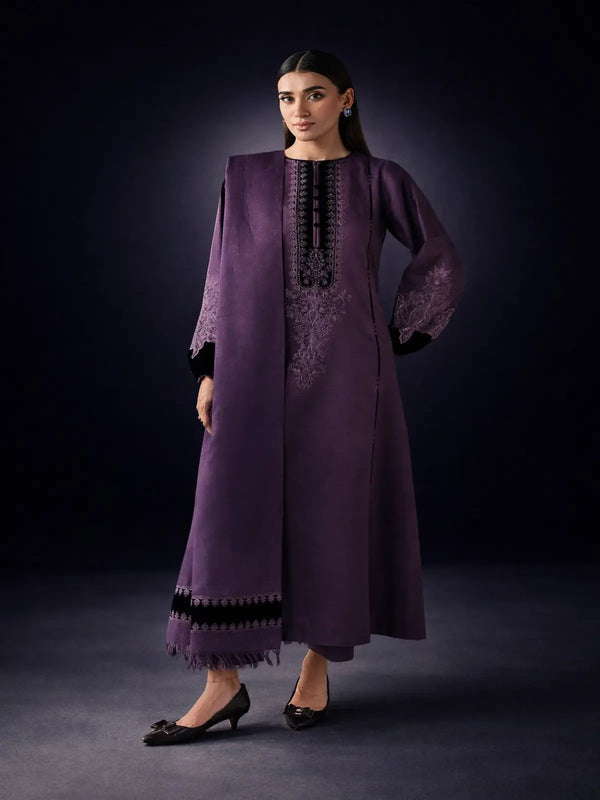 Woman wearing unstitched embroidered purple Dhanak suit set with matching dupatta and pants