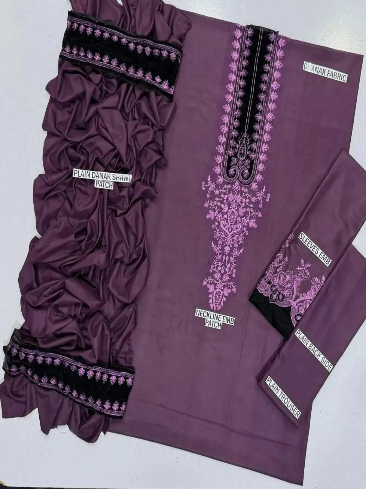 Purple unstitched women’s embroidered suit set with danak fabric, shawl, and detailed neckline patch.