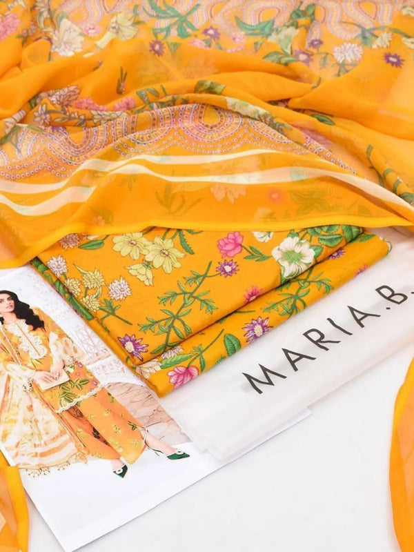 Bright yellow unstitched suit fabric set with colorful floral prints and embroidery, includes scarf and design booklet.