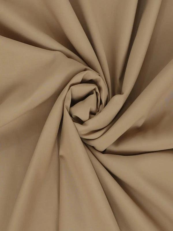 Light brown Swiss plain suit fabric, close-up texture with soft folds, unstitched material