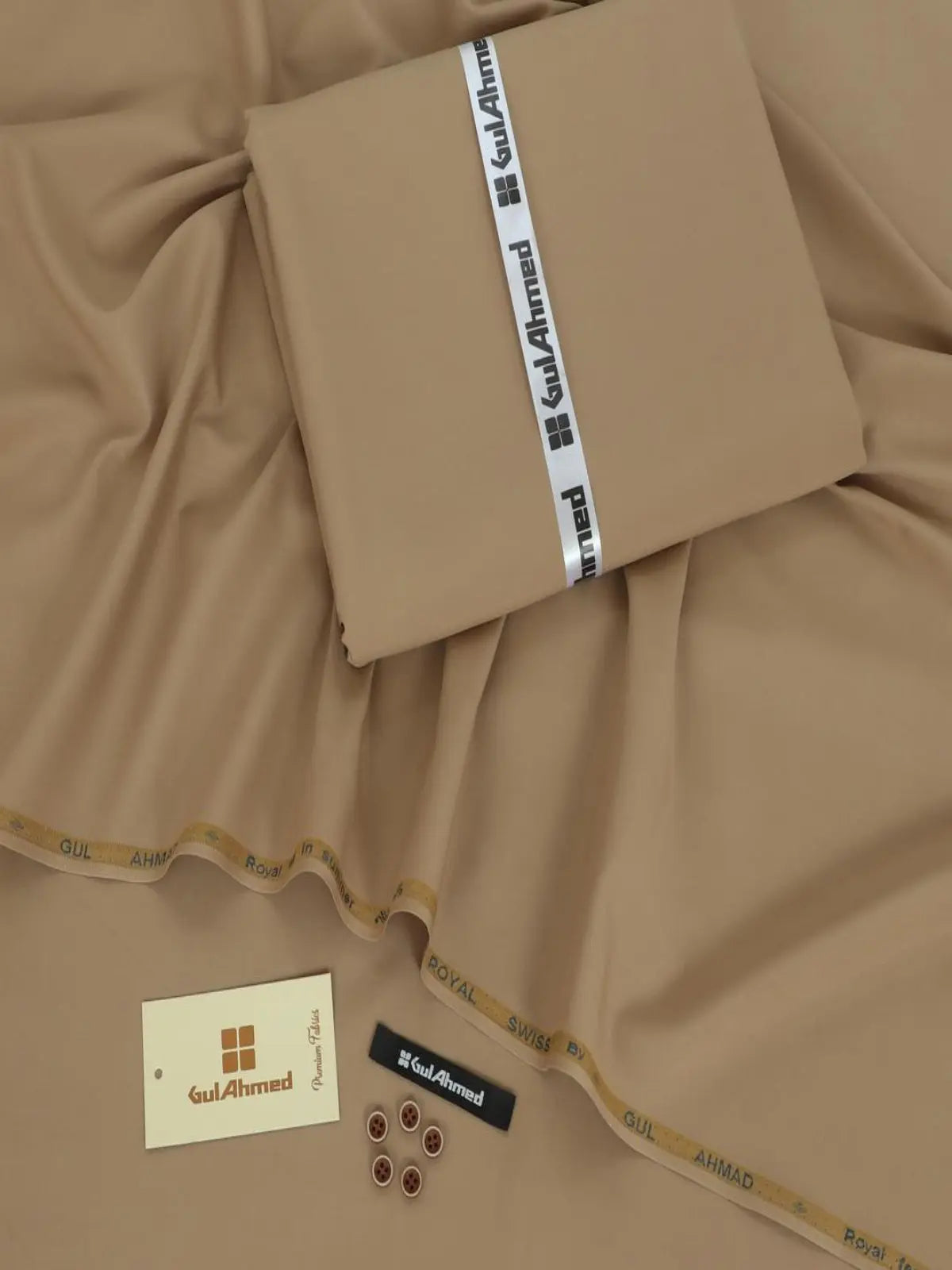 Light brown unstitched fabric for men’s suit with Gul Ahmed labels and matching buttons.