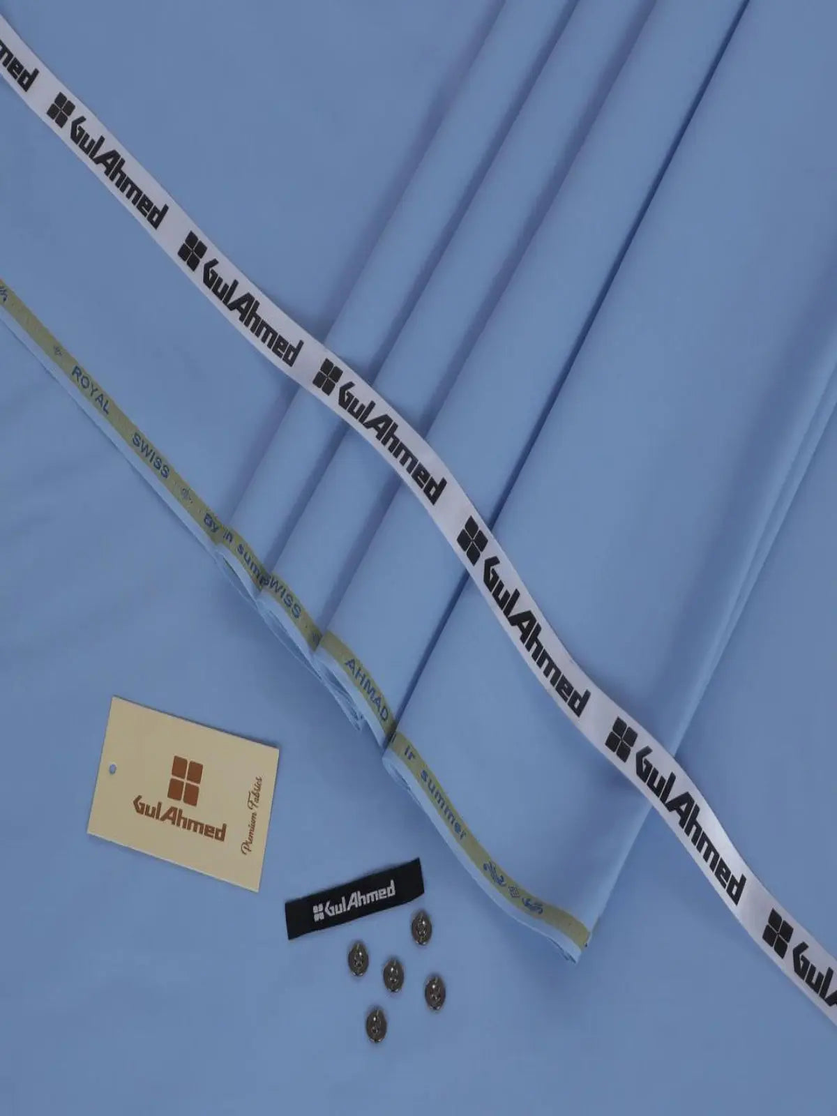 Men’s light blue wash and wear unstitched fabric with buttons and tags, perfect for summer suits.