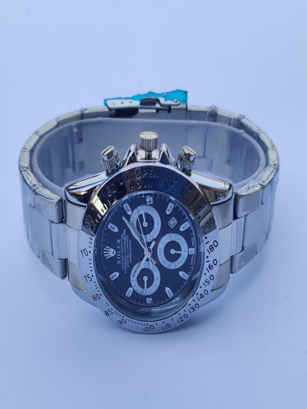 Silver watch with a blue face on a light blue background
