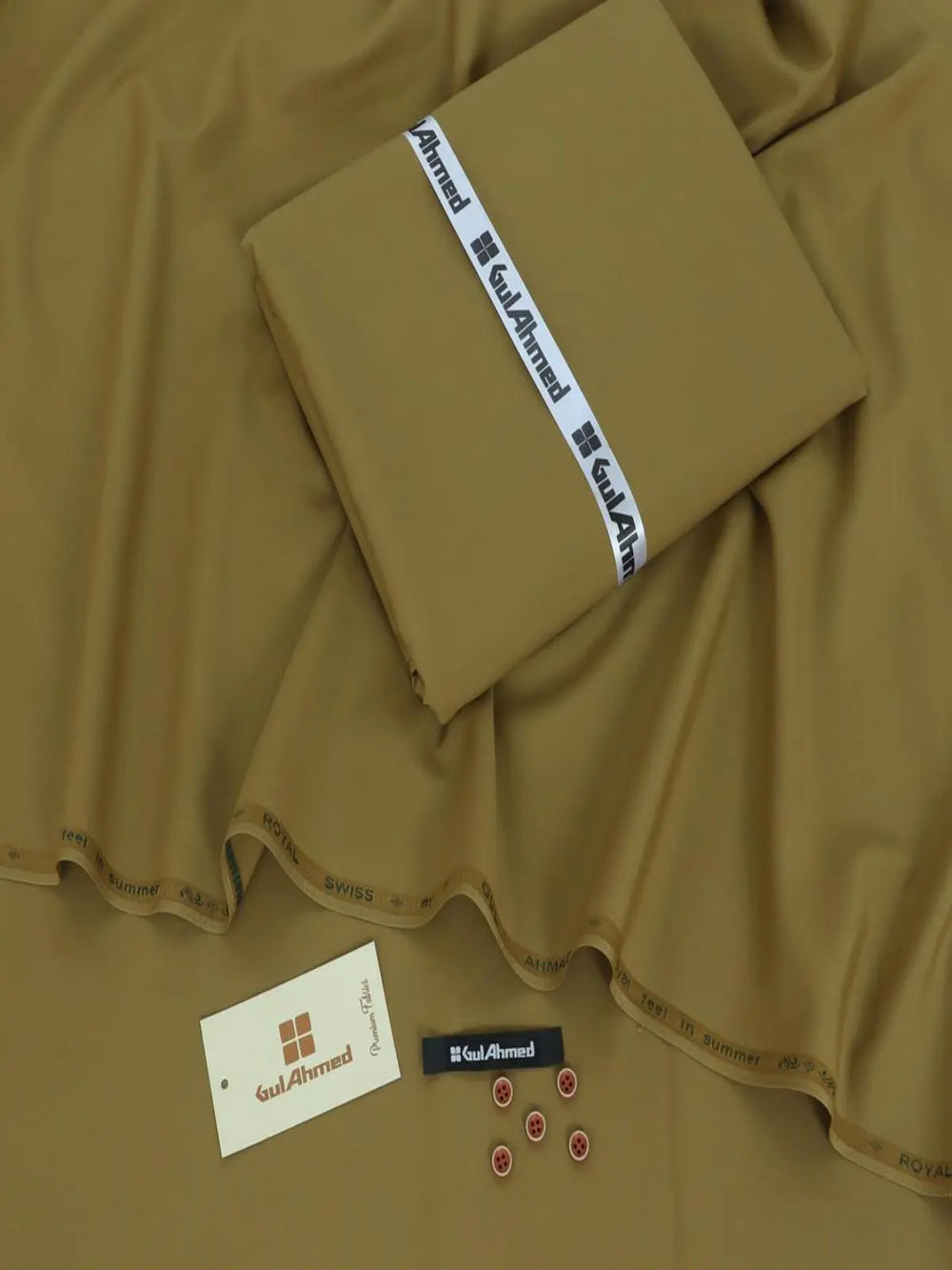 Men's unstitched wash wear suit fabric in camel brown with buttons and tags