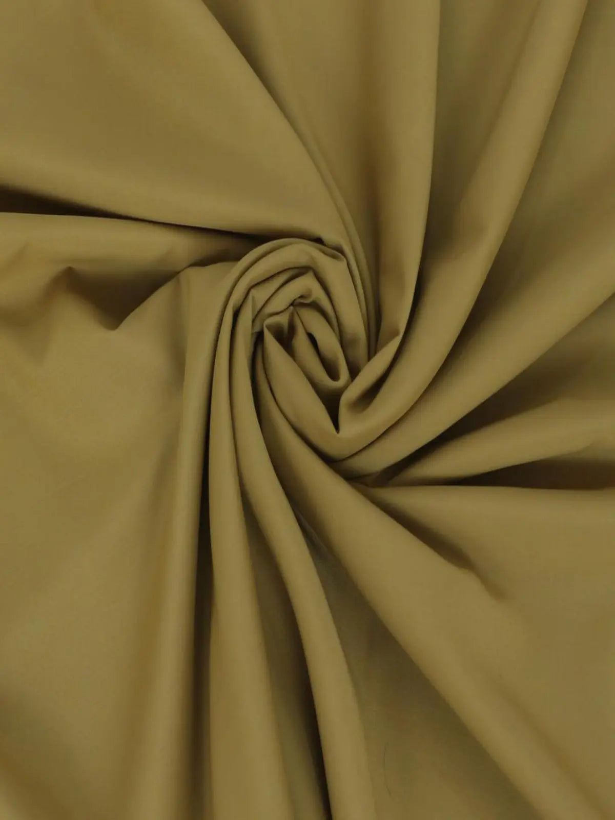 Men's unstitched wash wear fabric in beige, smooth texture, folded in swirls