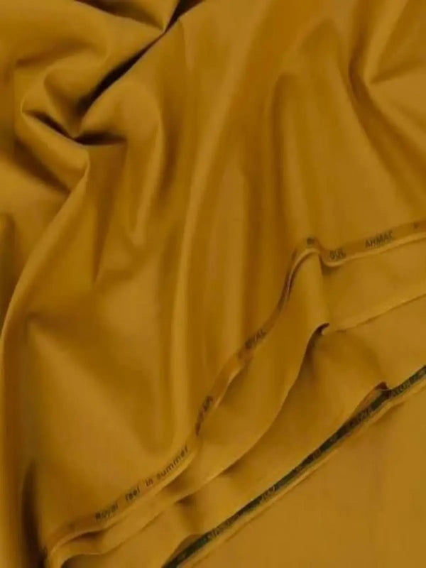 Unstitched mustard yellow men's wash and wear suit fabric draped and folded