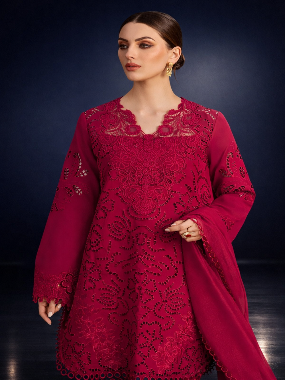 Woman wearing elegant pink chikankari suit with intricate embroidery and matching dupatta
