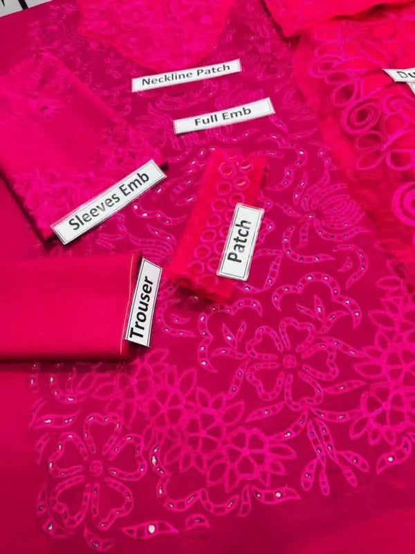 Pink chikankari suit fabric set with floral embroidery and labeled patches for neckline, sleeves, and trousers.